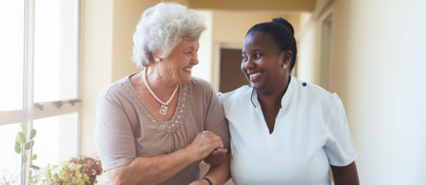 nurse and patient walking together